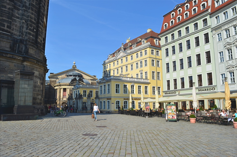 10 - The historic Neumarkt square in Dresden, Germany, featuring the grand Coselpalais in the background and outdoor restaurant seating alongside reconstructed Baroque-style buildings